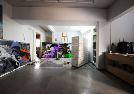 Wide angle interior view of Devidas Dharmadhikari's spacious art studio in Pune, India