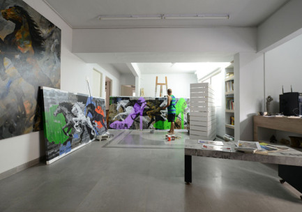 Devidas Dharmadhikari at work on a large canvas painting in his Warje studio in Pune