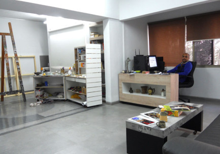 Creative desk area of the art studio with artist Devidas Dharmadhikari